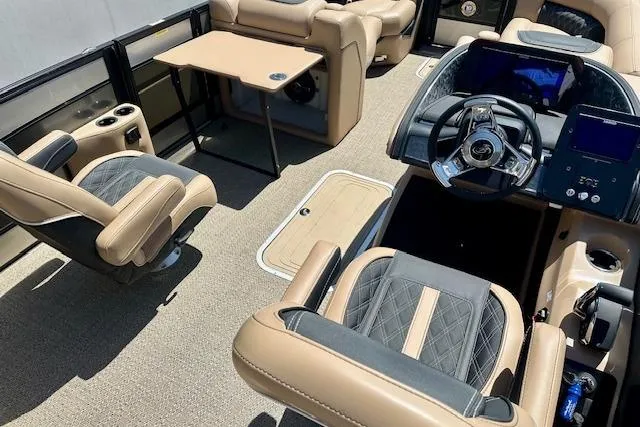 Slide: The Image of Luxurious 2026 Barletta L23UC boat interior with plush seating and modern dashboard. - 4