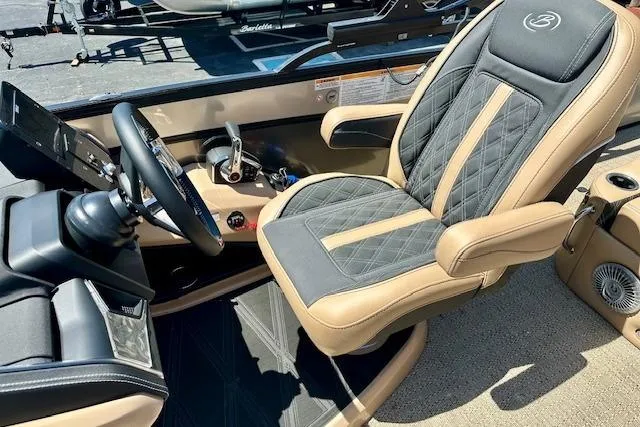 Slide: The Image of Captain's seat of 2026 Barletta L23UC boat, featuring luxurious design and modern controls. - 5