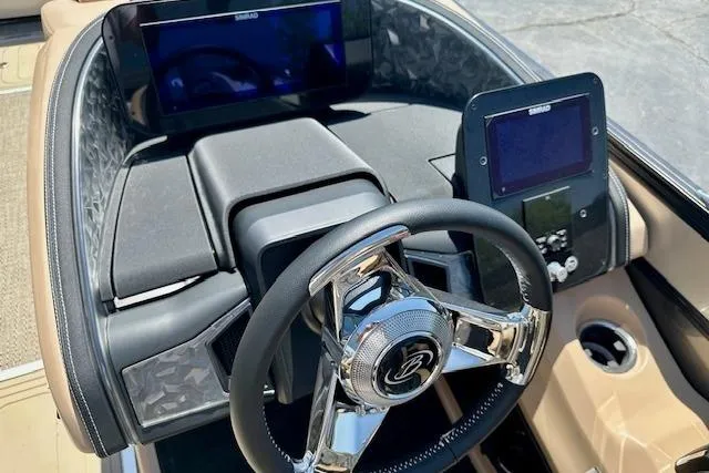Slide: The Image of 2026 Barletta L23UC boat dashboard with modern steering wheel and digital displays. - 6