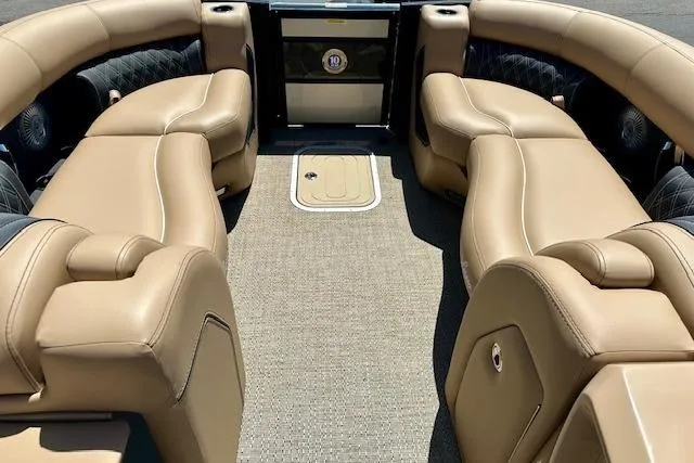 Slide: The Image of Luxurious interior of 2026 Barletta L23UC pontoon boat with tan leather seating. - 7
