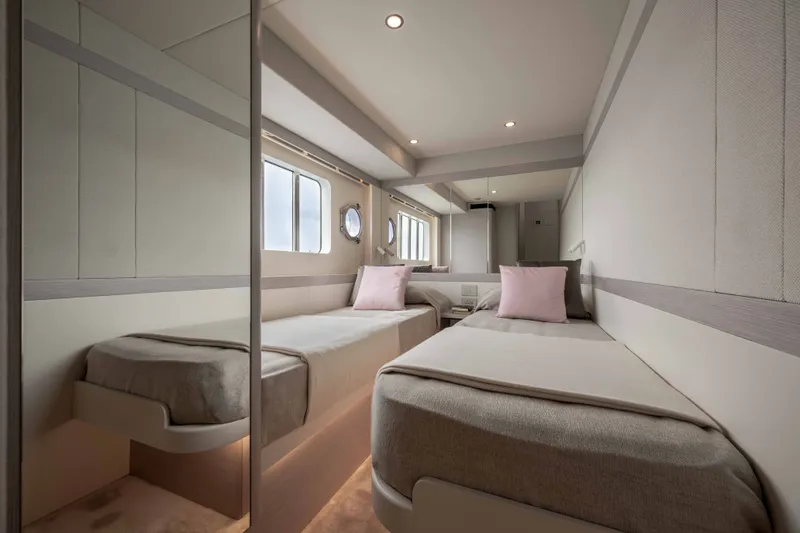 Slide: The Image of Luxurious twin cabin interior on 2027 Absolute 50 Navetta yacht, featuring modern design and soft lighting. - 37