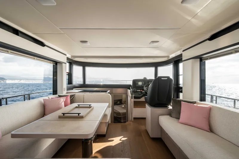 Slide: The Image of Luxurious interior of 2027 Absolute 50 Navetta yacht with elegant seating and ocean view. - 23
