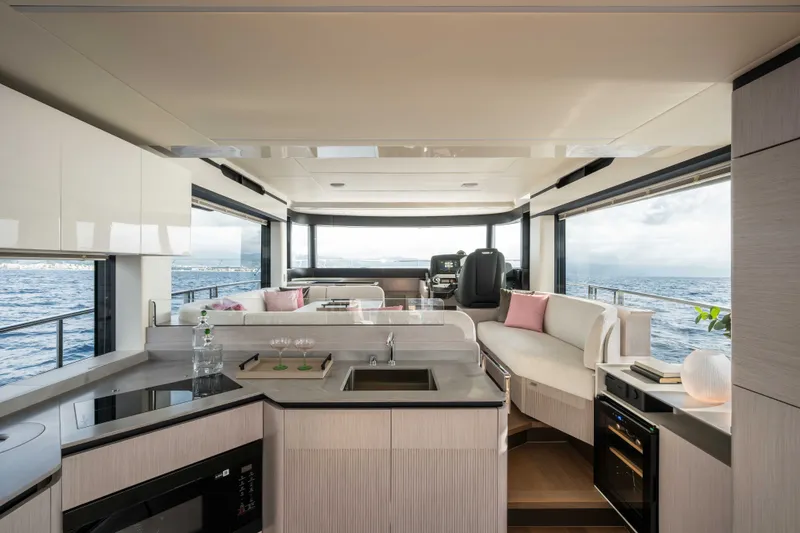 Slide: The Image of Luxurious interior of 2027 Absolute 50 Navetta yacht with modern kitchen and ocean view. - 22