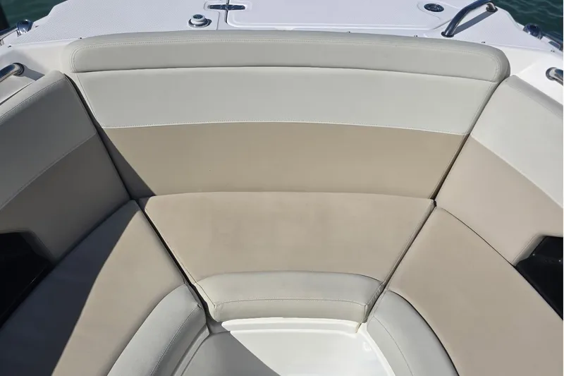 Slide: The Image of 2021 Boston Whaler 240 Vantage boat seating area with beige and gray upholstery. - 11