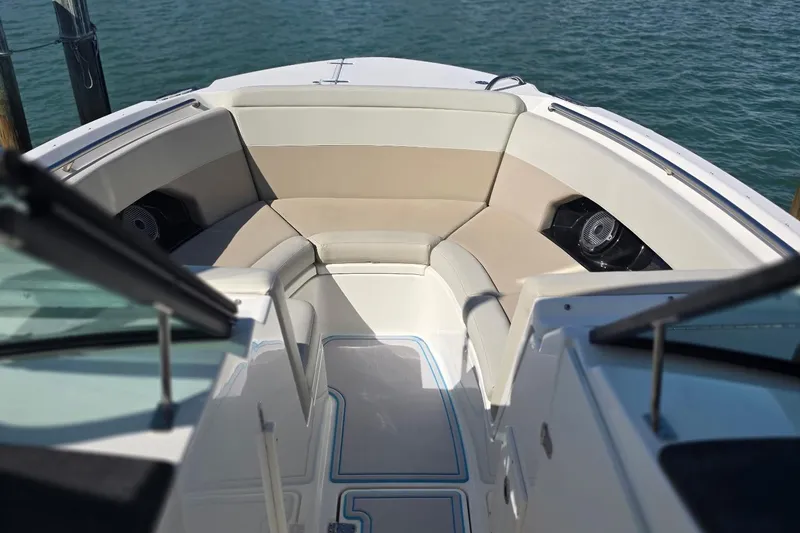 Slide: The Image of 2021 Boston Whaler 240 Vantage boat interior with cushioned seating and speakers. - 12