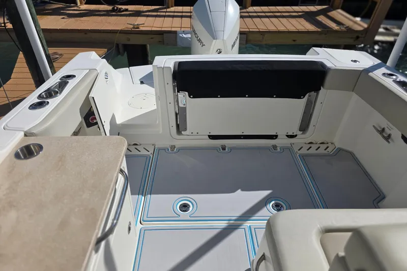 Slide: The Image of 2021 Boston Whaler 240 Vantage boat interior with seating and deck details. - 14