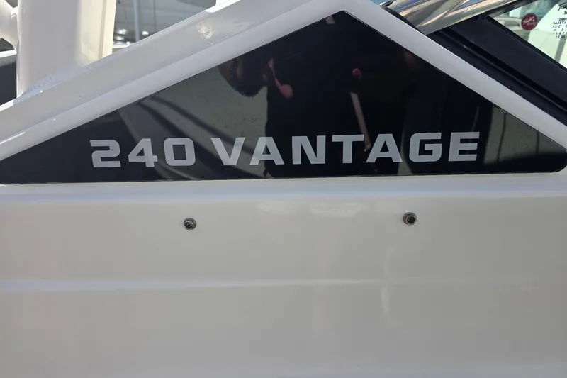 Slide: The Image of 2021 Boston Whaler 240 Vantage boat nameplate in close-up view. - 16