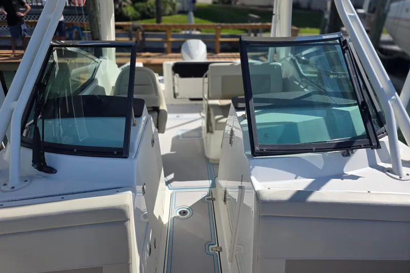 Slide: The Image of 2021 Boston Whaler 240 Vantage boat interior with dual consoles and seating. - 21
