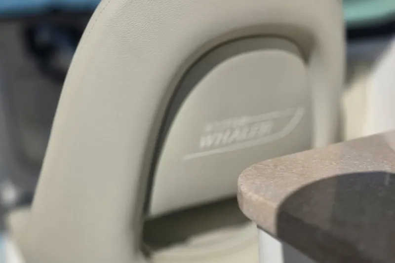 Slide: The Image of Close-up of 2021 Boston Whaler 240 Vantage seat and table detail. - 23