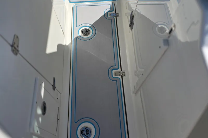 Slide: The Image of Interior view of 2021 Boston Whaler 240 Vantage boat, showcasing storage compartments. - 27
