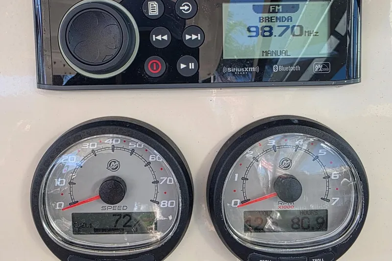 Slide: The Image of Dashboard of a 2021 Boston Whaler 240 Vantage with radio and speed gauges. - 28