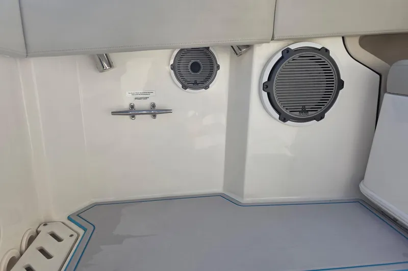 Slide: The Image of Interior of 2021 Boston Whaler 240 Vantage boat with speakers and seating. - 33