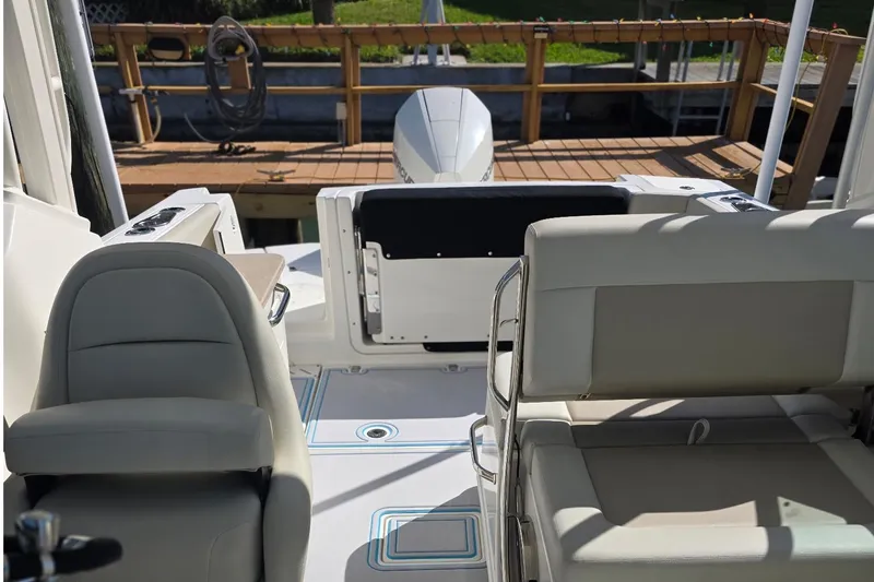 Slide: The Image of 2021 Boston Whaler 240 Vantage boat interior with seating and deck view. - 39