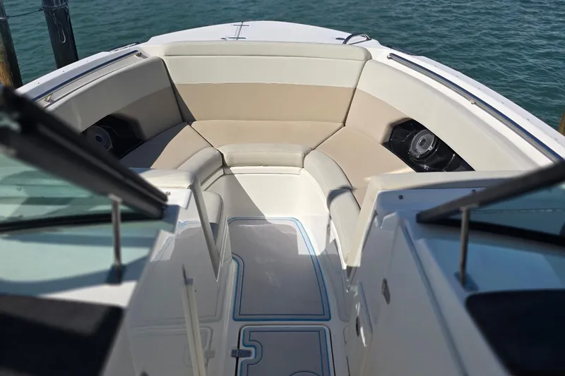 Slide: The Image of 2021 Boston Whaler 240 Vantage boat interior with cushioned seating and ocean view. - 42