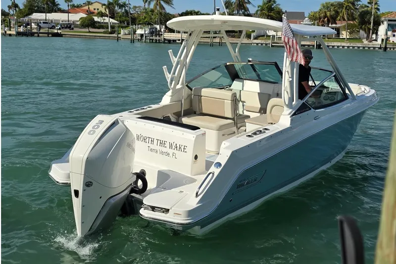 Slide: The Image of 2021 Boston Whaler 240 Vantage boat on water, featuring "Worth the Wake" text. - 5