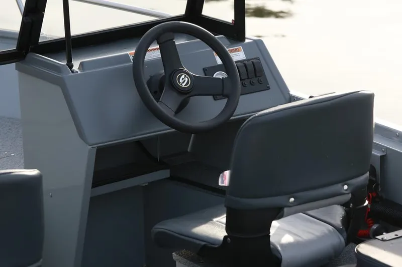 Slide: The Image of Manufacturer Provided Image: 2016 Smoker Craft Pro Tracer 162 boat cockpit with steering wheel and seat. - 5