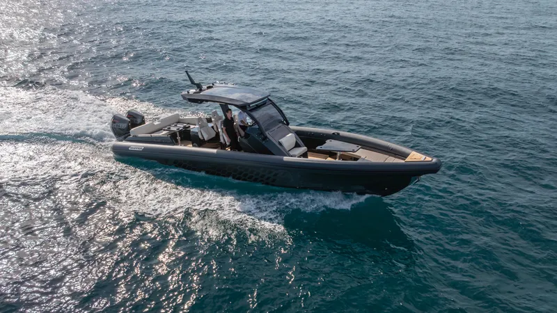 Slide: The Image of 2025 Skipper 38 boat cruising on open water. - 2