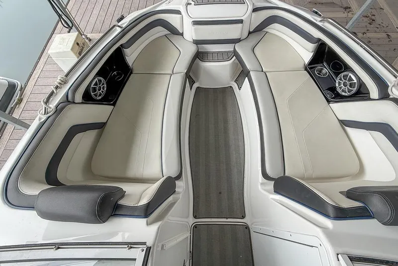 Slide: The Image of 2019 Yamaha Boats 242 Limited S E-Series interior with cushioned seating and cup holders. - 10