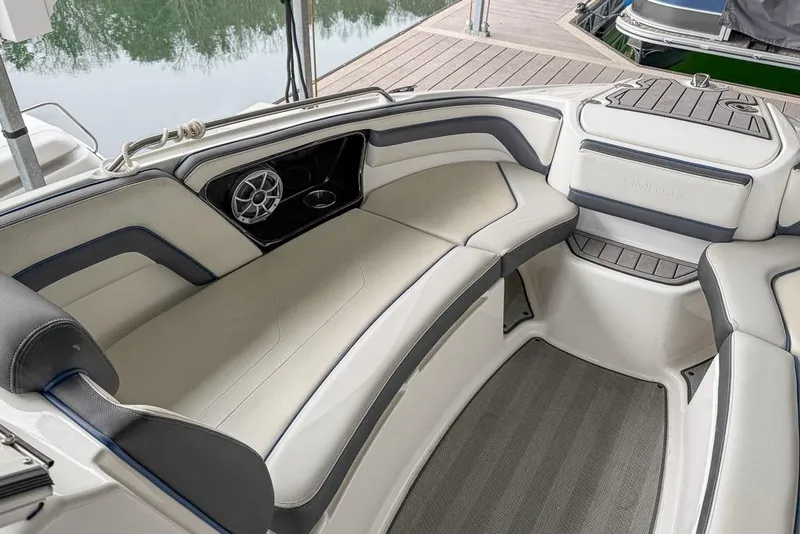 Slide: The Image of 2019 Yamaha Boats 242 Limited S E-Series interior with plush seating and speaker system. - 11