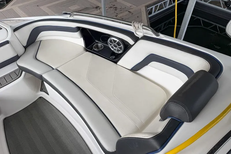 Slide: The Image of 2019 Yamaha Boats 242 Limited S E-Series interior seating with speaker and cup holders. - 12