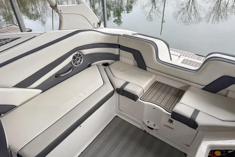 Slide: The Image of 2019 Yamaha Boats 242 Limited S E-Series interior seating with sleek design and speaker. - 15