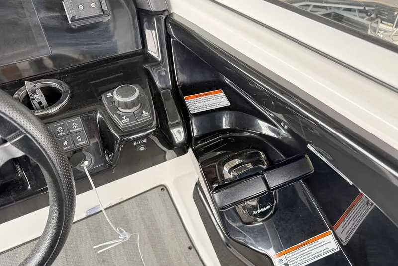 Slide: The Image of 2019 Yamaha Boats 242 Limited S E-Series dashboard with controls and steering wheel. - 20