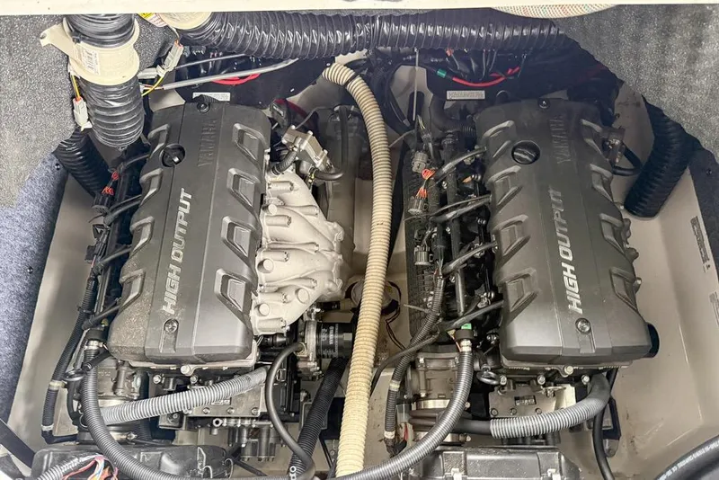 Slide: The Image of 2019 Yamaha Boats 242 Limited S E-Series engine compartment with dual high output engines. - 21