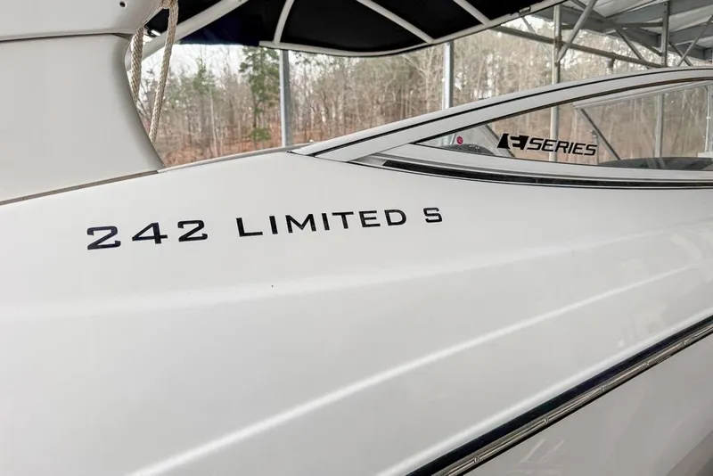 Slide: The Image of 2019 Yamaha Boats 242 Limited S E-Series, sleek white exterior detail. - 24