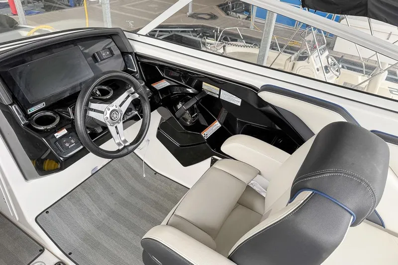 Slide: The Image of 2019 Yamaha Boats 242 Limited S E-Series cockpit with steering wheel and dashboard. - 3