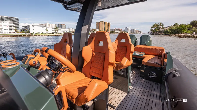 Slide: The Image of Luxurious 2025 Skipper-BSK 38 boat interior with orange seats, cruising on a scenic waterway. - 46