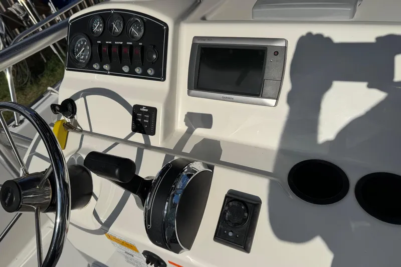 Slide: The Image of Control panel of a 2013 Boston Whaler 210 Montauk boat with Garmin display. - 16