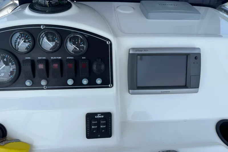 Slide: The Image of Dashboard of a 2013 Boston Whaler 210 Montauk with Garmin GPS and control panel. - 18
