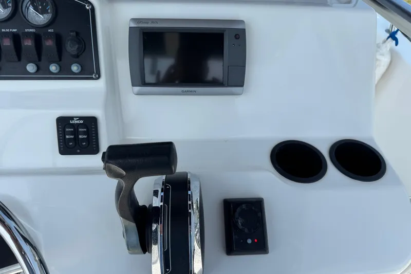 Slide: The Image of Control panel of a 2013 Boston Whaler 210 Montauk with Garmin GPS and throttle. - 19