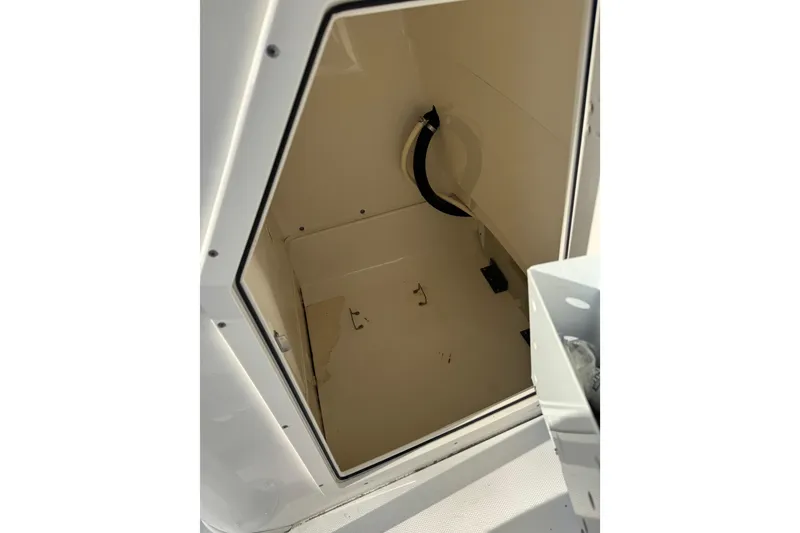 Slide: The Image of Storage compartment of 2013 Boston Whaler 210 Montauk boat, open and empty. - 30