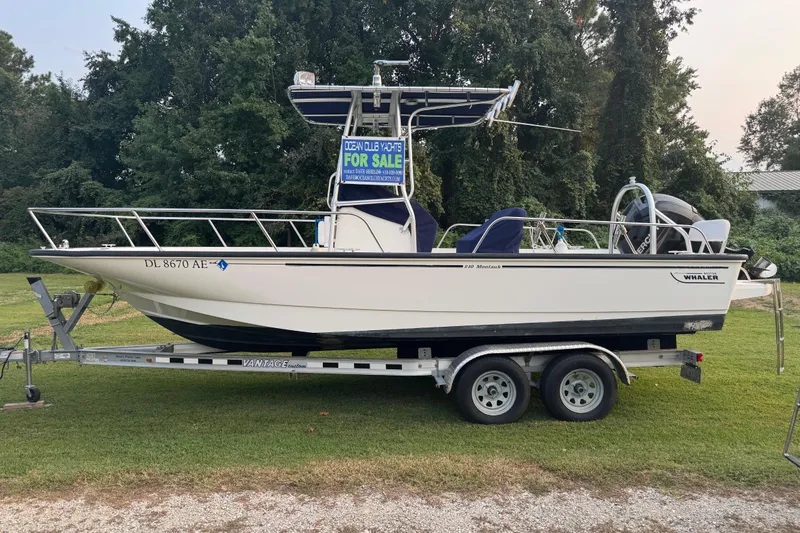 Slide: The Image of 2013 Boston Whaler 210 Montauk boat on trailer, for sale sign visible. - 31