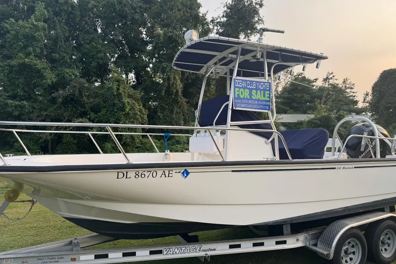 Slide: The Image of 2013 Boston Whaler 210 Montauk boat for sale on trailer, outdoor setting. - 32