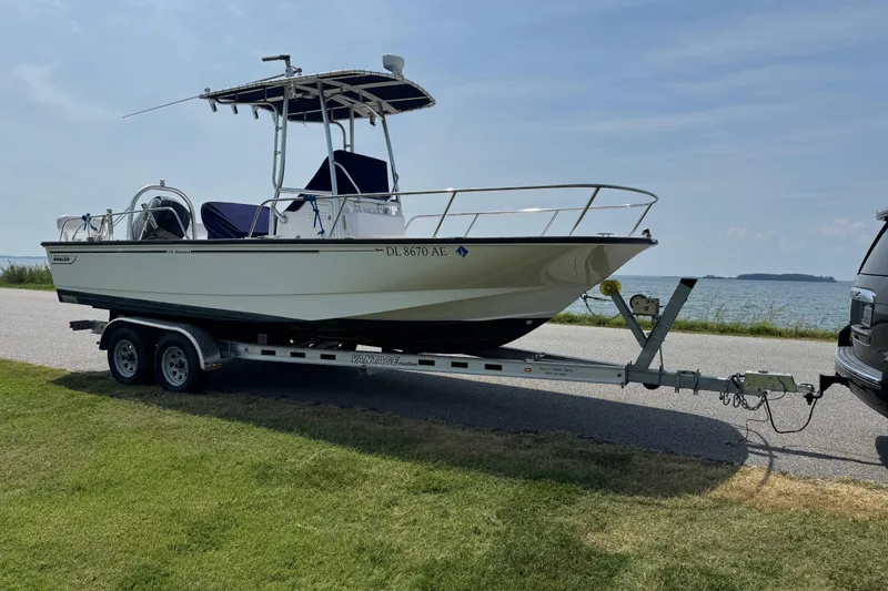 Slide: The Image of 2013 Boston Whaler 210 Montauk boat on trailer by the waterfront. - 7