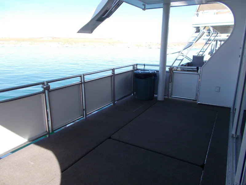 Slide: The Image of Deck of a 2015 Bravada Intrepid Trip #13 houseboat with lake view. - 30