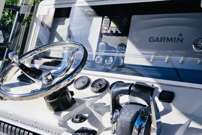 Slide: The Image of 2019 SeaVee 370Z boat dashboard with Garmin navigation system and steering wheel. - 7