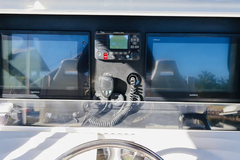 Slide: The Image of Control panel of 2019 SeaVee 370Z boat with Garmin displays and communication equipment. - 8
