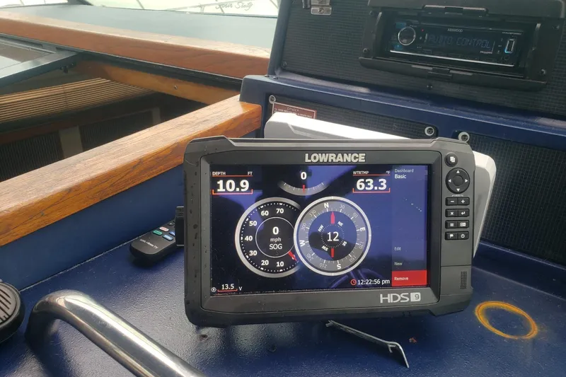 Slide: The Image of Lowrance HDS-9 marine display on 1988 Sea Ray 390 Express Cruiser dashboard. - 16