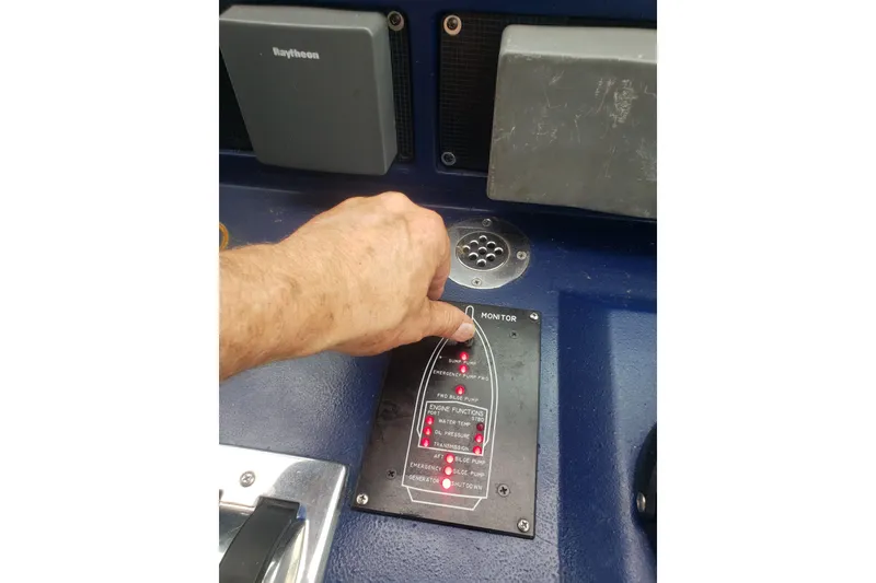 Slide: The Image of Hand operating control panel on 1988 Sea Ray 390 Express Cruiser boat. - 24