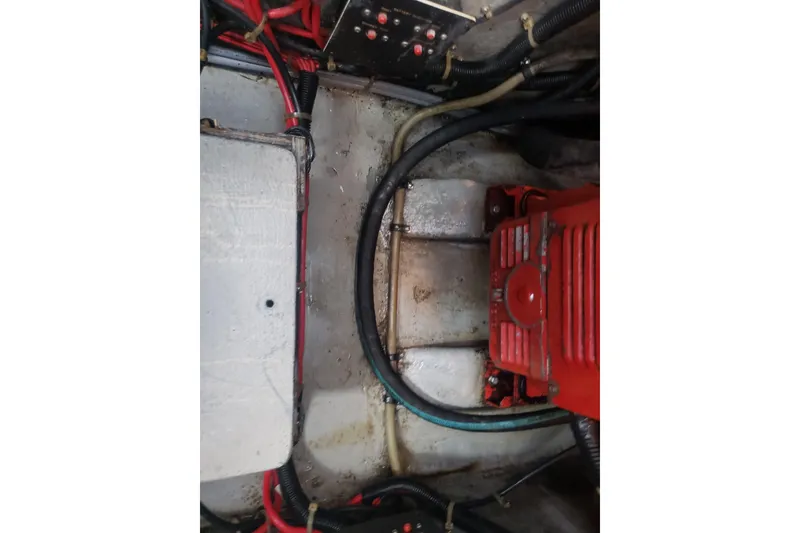 Slide: The Image of Engine compartment of 1988 Sea Ray 390 Express Cruiser with visible wiring and components. - 28