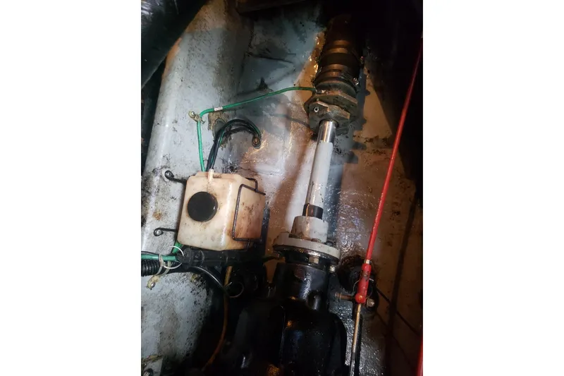 Slide: The Image of Engine compartment of a 1988 Sea Ray 390 Express Cruiser, showing mechanical components. - 29