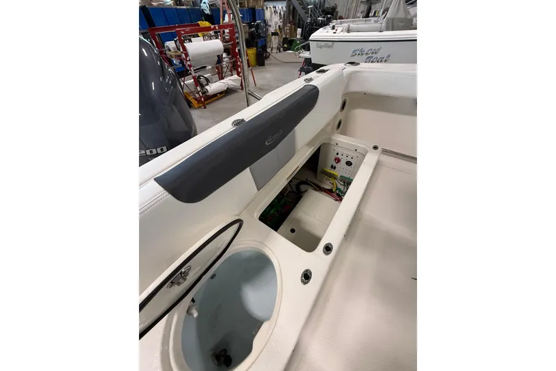 Slide: The Image of 2021 Robalo R222 Center Console boat interior with open storage compartments. - 14