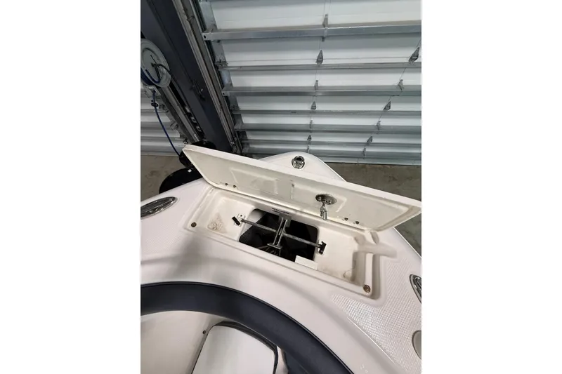 Slide: The Image of Open storage compartment on 2021 Robalo R222 Center Console boat. - 20