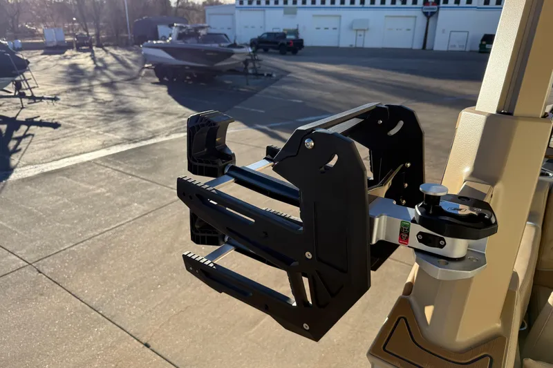 Slide: The Image of 2026 Nautique Super Air Nautique G25 Paragon wakeboard rack in a sunlit marina. - 26