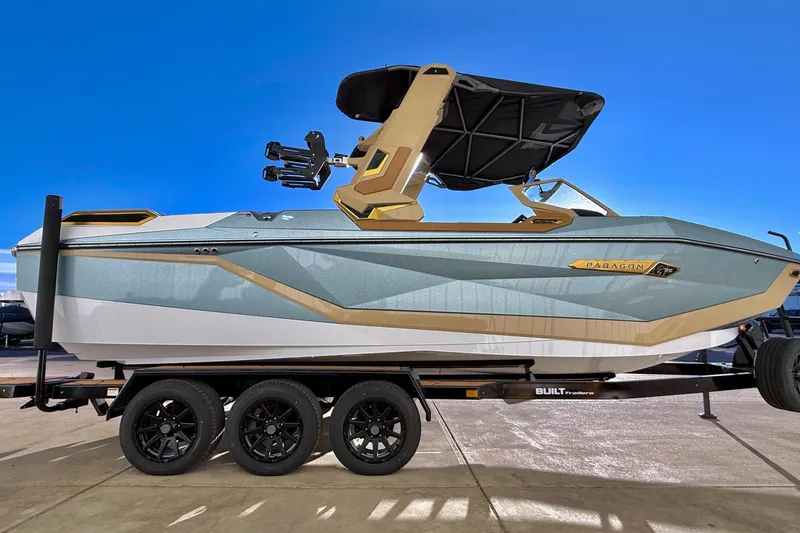 Slide: The Image of 2026 Nautique Super Air Nautique G25 Paragon boat on trailer, side view. - 6