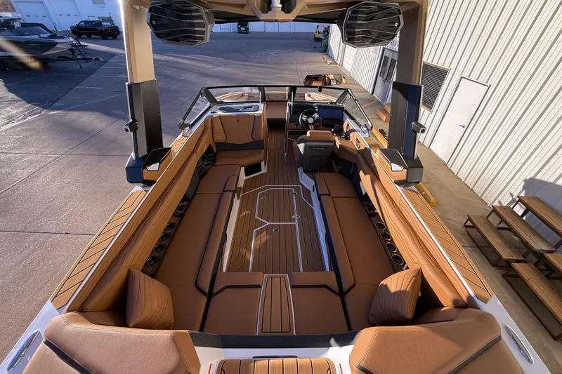 Slide: The Image of 2026 Nautique Super Air Nautique G25 boat interior with luxurious seating and modern design. - 12
