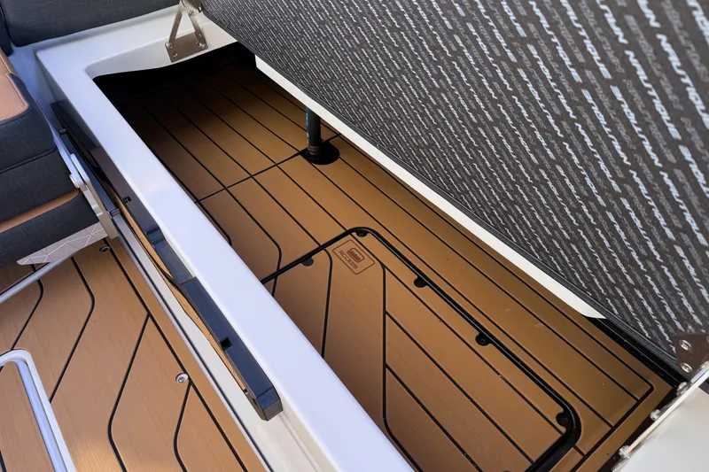 Slide: The Image of 2026 Nautique Super Air Nautique G25 storage compartment with sleek, modern design. - 22